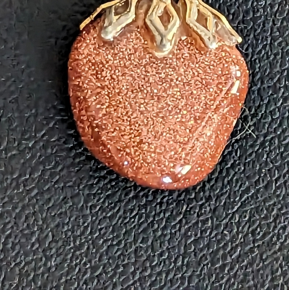 A Sunstone pendant on a Gold toned chain 19” inches. - Picture 3 of 5